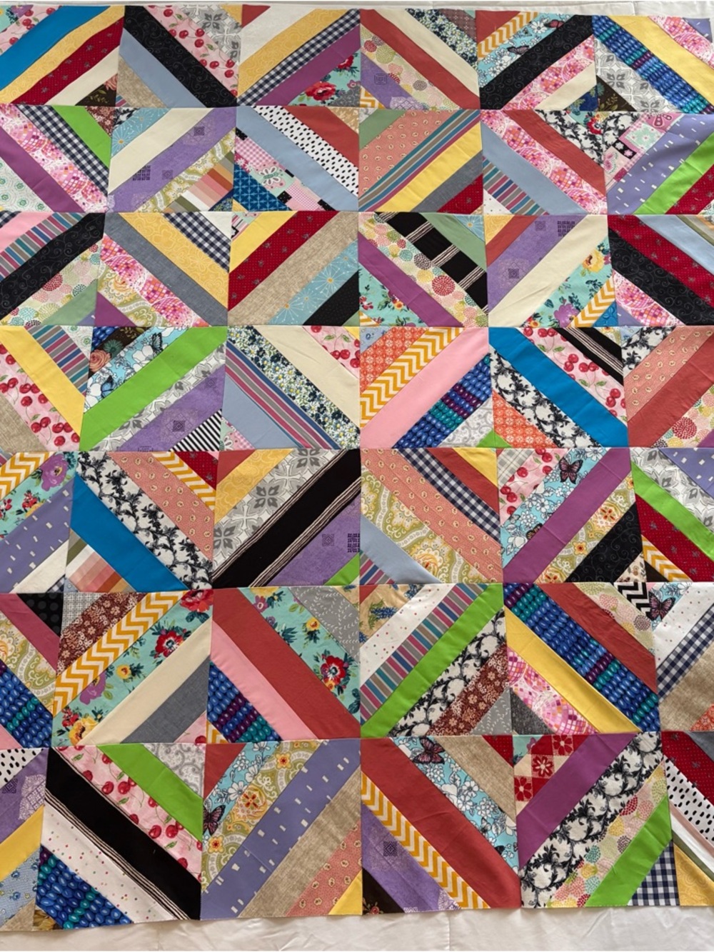 Beautiful new scrappy string quilt top!